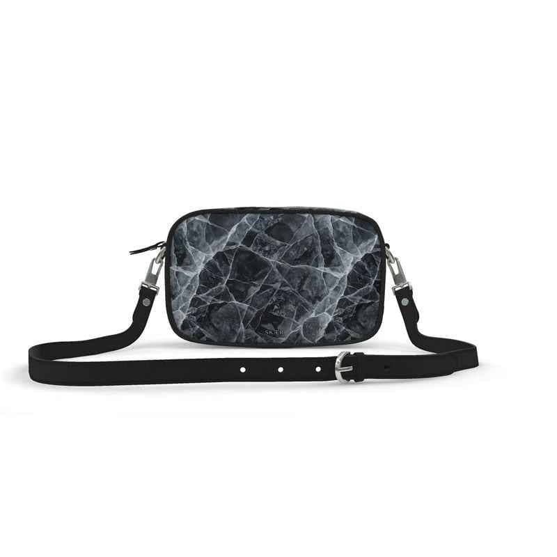 SKÆR STUDIO architectural designer purse with a sleek black marble pattern and adjustable strap
