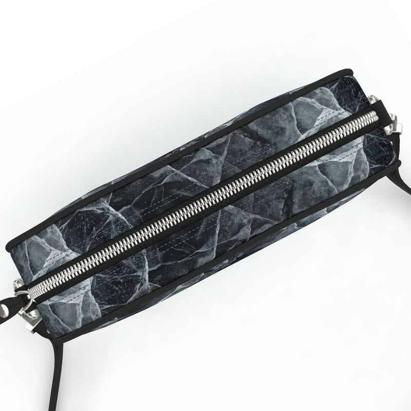 SKÆR STUDIO architectural designer purse with a sleek marble pattern and strong zipper closure