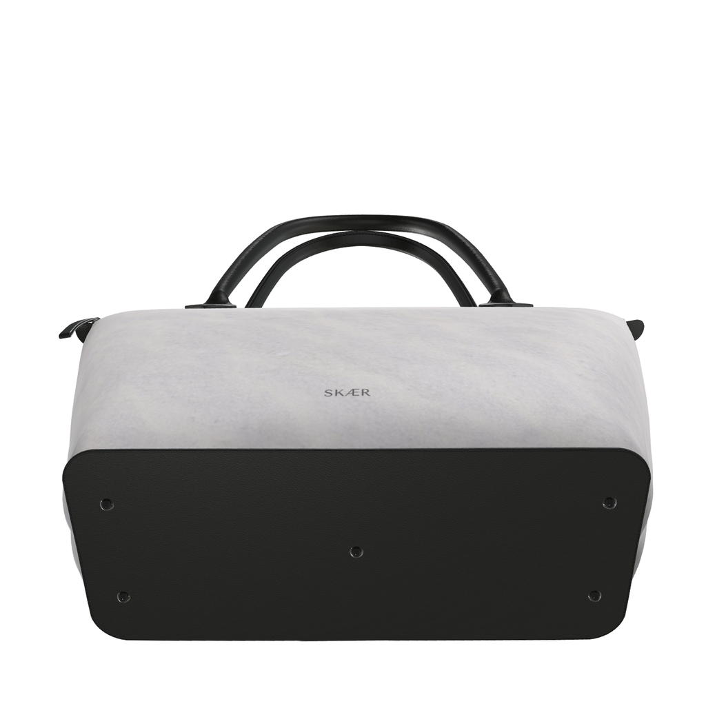 SKÆR STUDIO Zip Top Handbag in gray and black, featuring an arctic inspired designer tote bag design