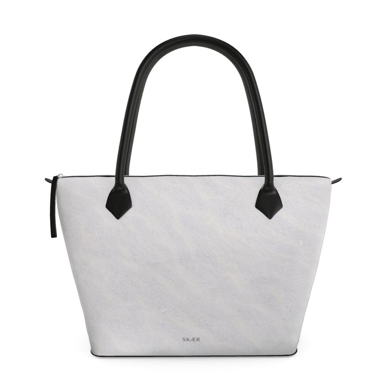 SKÆR STUDIO Arctic inspired designer tote bag with sleek zip top and elegant black handles