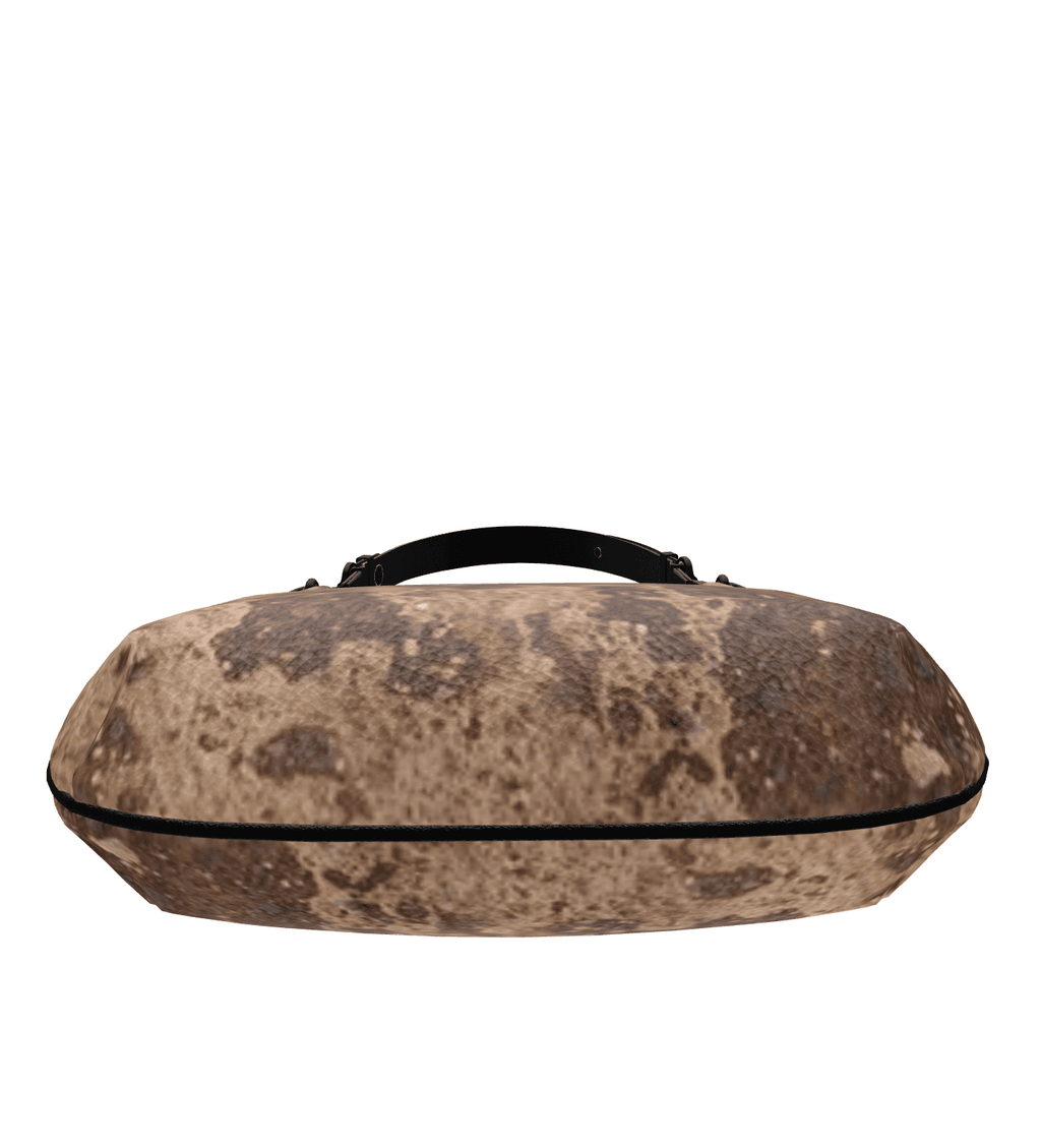 SKÆR STUDIO Mini Curve Bag in textured design, a unique designer handbag for stylish outings